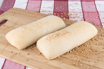 smal bread on wooden board