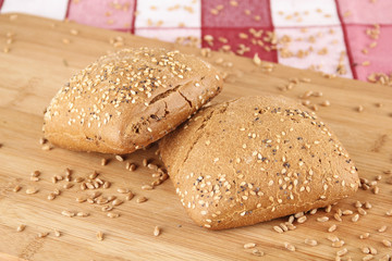 2 small breads on wooden board