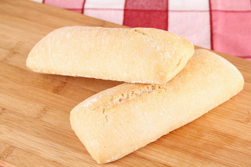 small bread on wooden board