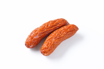 Kielbasa sausages on white background