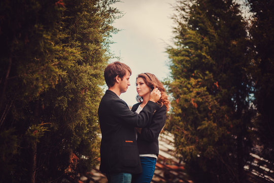 Sensual outdoor portrait of young fashion couple posing