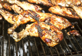 Roast chicken leg on grill