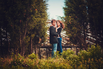 Sensual outdoor portrait of young fashion couple