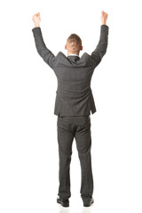 Young businessman celebrating his business success