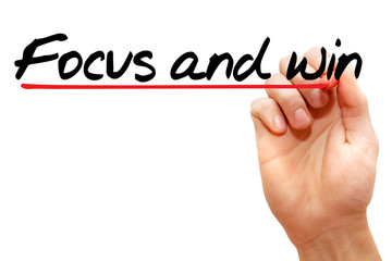 Hand writing Focus and win with marker, business concept