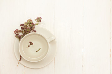 Fototapeta na wymiar A cup of organic thyme tea (thymus serpyllum)