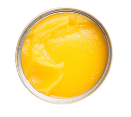 Indian ghee in a tin can over white background