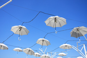 White Umbrella on the Blue sky background