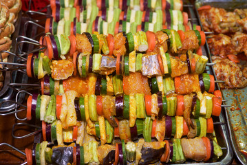 Prepared raw skewers of seafood