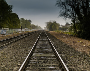 Fototapeta na wymiar Perspective Railroad in a Cloudy Day