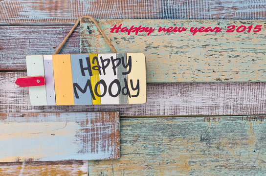 Happy or Moody sign board on wooden vintage background