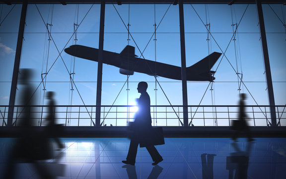Business man walking silhouette in the airport