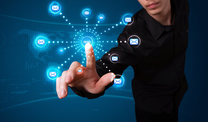 Businessman pressing virtual messaging type of icons