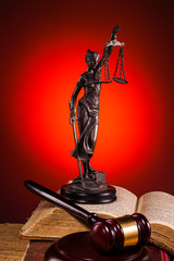 gavel, lady of justice and old book