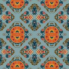 Seamless background from a floral ornament orange tribal style o