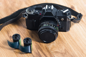 Old 35mm analog camera on the table