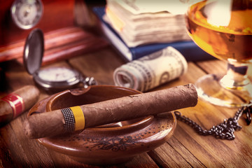 Relaxing cuban cigar after hard day, with glass of Rum