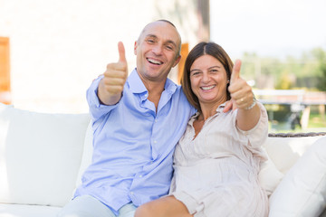 Mature Couple Showing Thumbs Up