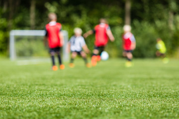 Obraz na płótnie Canvas Kids soccer blur