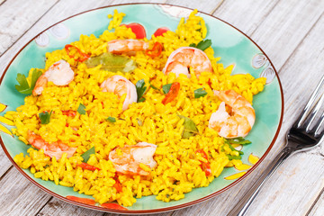 Shrimps Risotto garnished with parsley and red chili pepper