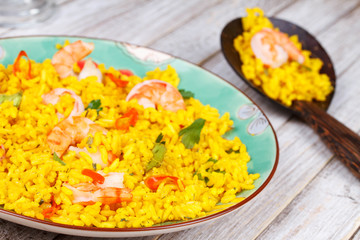 Shrimps Risotto garnished with parsley and red chili pepper