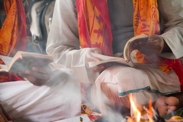 Brahmin reading hindu puja in Nepal