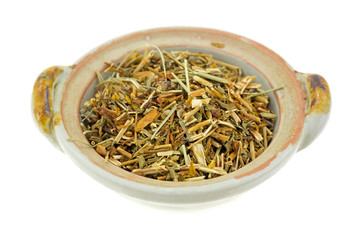 Bowl of St. Johns Wort on a white background