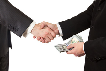 Handshake businessmen with money in hand