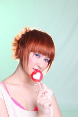 girl in white dress with candy heart with red hair