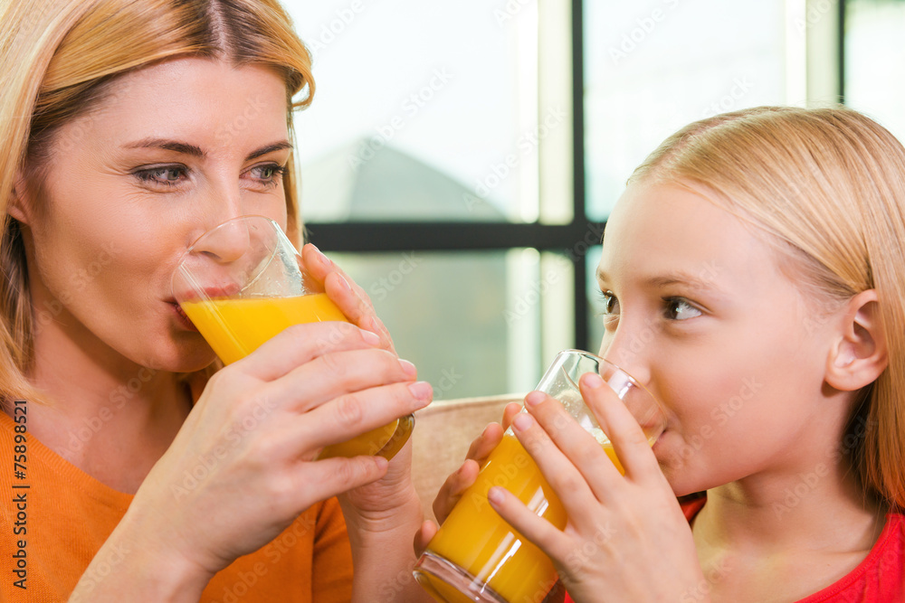 Wall mural enjoying fresh juice together.