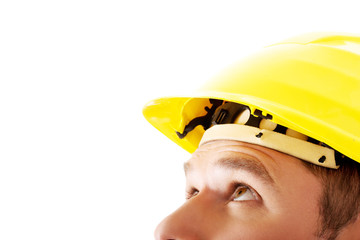 Portrait of a man with hardhat looking up