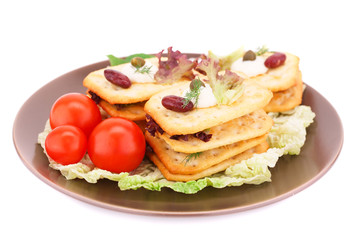 Crackers with fresh vegetables and cream