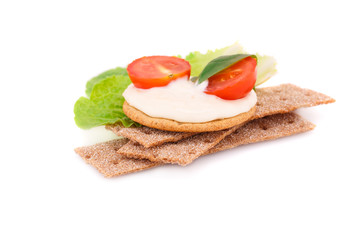 Crackers with fresh vegetables and cream
