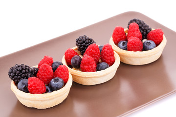 Fresh ripe berries in tartlets