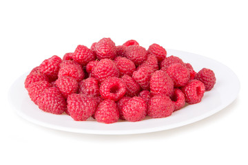 ripe red raspberries in a bowl