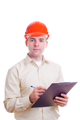 Engineer in helmet writing something