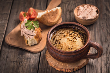 Mug of coffee and pate with bread still-life