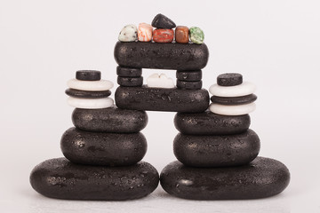 Row Of Chakra Crystals on hot massage black stones