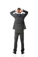 Full length businessman putting hands on the nape