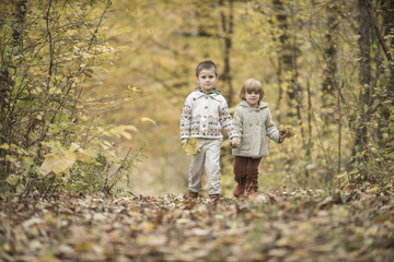Fototapeta premium Children playing in a forest