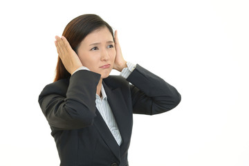 困った表情のOL