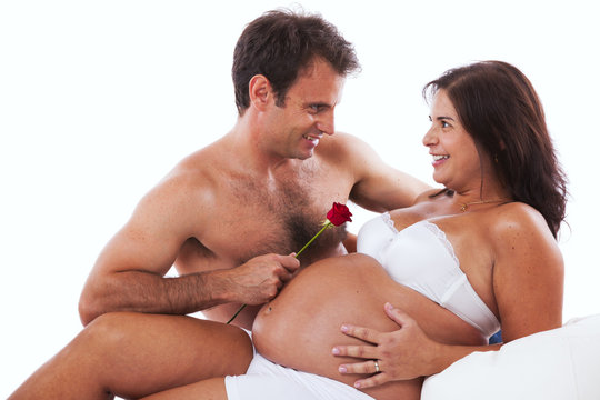 Husband embrassing his pregnant wife