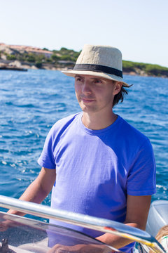 Young man enjoy summer vacation on boat