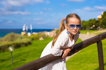 Adorable little girl during summer vacation outdoors