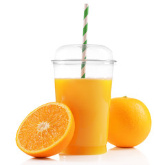 Orange juice in fast food closed cup with tube and slice of