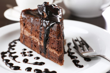 Yummy chocolate cake served on table, close-up