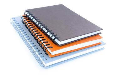 Stack of notebooks (or copybooks) on white background