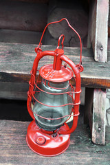 Kerosene lamp on wooden stairs, outdoors