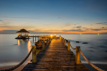 Landscape of Wooded bridge pier between sunset