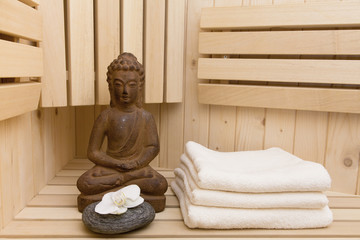 buddha statue and zen stones in sauna